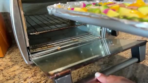 Placing Tray Freshly Chopped Organic Vegetables Toaster Oven Slow Motion — Stockvideo