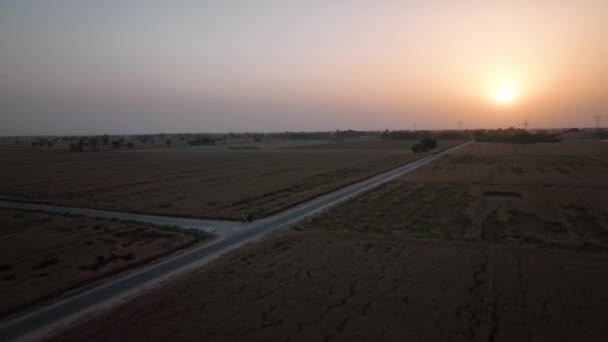 Aerial View Empty Road Rural Farm Land Orange Sunset Skies — Stockvideo