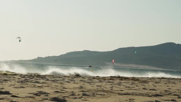 Strong Waves Hitting Sandy Tarifa Beach Spain Kiteboarders Sea — стоковое видео