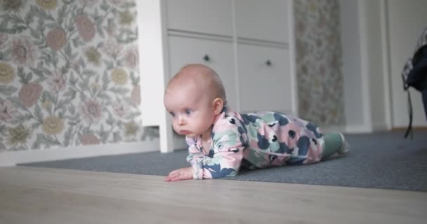 Baby Girl Crawls Home Floor Slow Motion Close Shot — стоковое видео