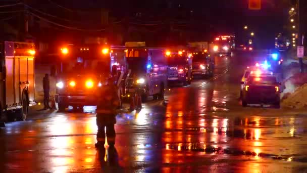 Toronto Emergency Firefighter Observing Street Closure Night Flashing Response Vehicles — Stock Video