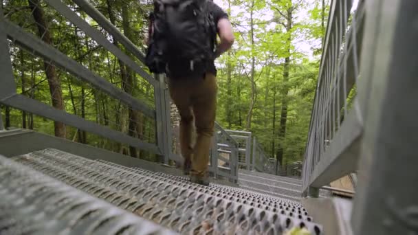Low Angle Shot Male Hiker Backpack Hurries Steep Metal Staircase — Video Stock