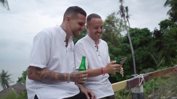 Happy Laughing Male Gay Couple Having Fun Drinking Beer Watching — Vídeo de stock