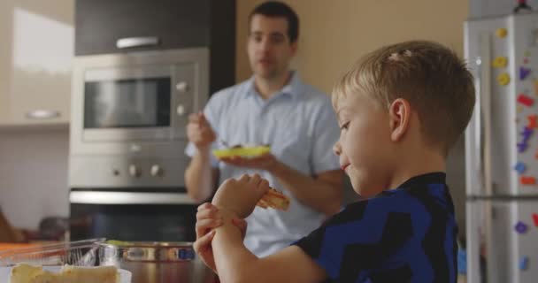 Slow Motion Shot Boy His Father Eating Dinner Together Kitchen – Stock-video