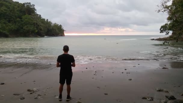 Man Looking Ocean Sunset Beach Playa Vaca Costa Rica Cloudy — Vídeos de Stock