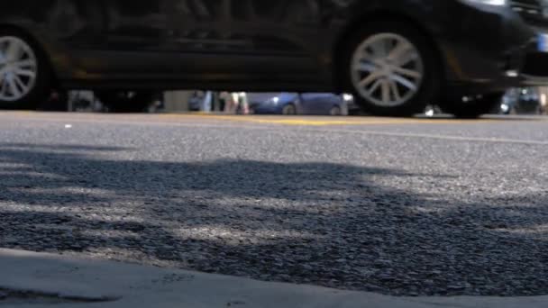 Asphalt Focus Foreground Blurred Trafic People Background Slow Motion — Stockvideo