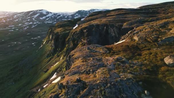 Aerial Sunlit Mountain Top Edge Hiker Standing Hardangervidda National Park — Stockvideo
