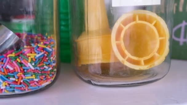 Close Slow Motion Tracking Shot Ice Cream Cones Sprinkles Chocolate — Stockvideo