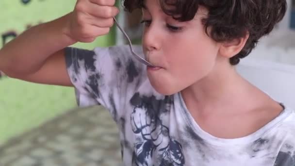 Close Shot Young Boy Eating Strawberry Vanilla Ice Cream Spoon — Wideo stockowe