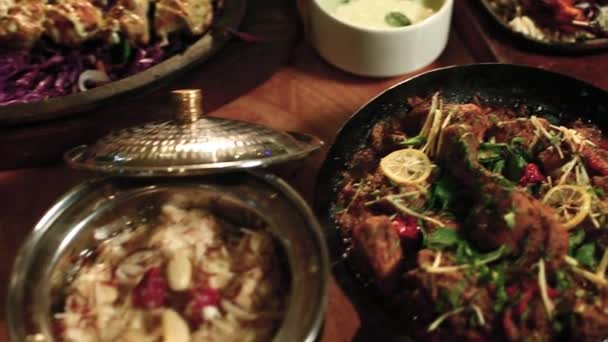 Various Indian Food Dishes Asian Food Table Top Track Shot — Vídeo de stock
