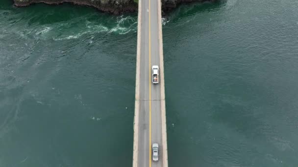 Top Aerial Cars Passing Bridge Vibrant Blue Water — Stock Video