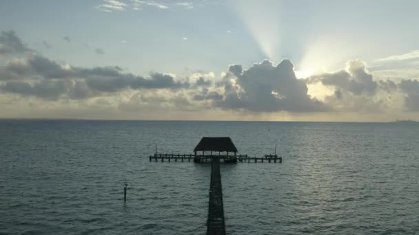 Aerial Drone Tilt Shot Sun Rays Clouds Wooden Pier Sea — Vídeos de Stock