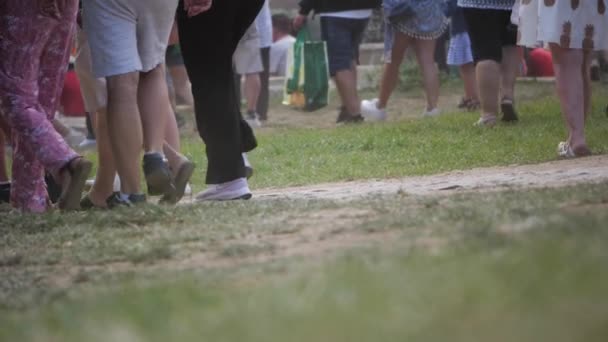 Slow Motion People Feet Walking Grass Music Festival Low Angle — Stockvideo