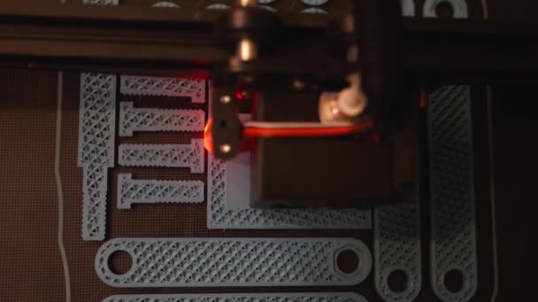 Slow Motion Top View Printer Builds Number Plastic Components — Stock video