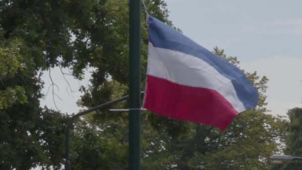 240 Fps Slow Motion Upside Dutch Flags Hanging Streetlights Sign — Stok Video