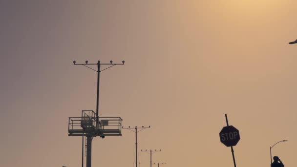 Shot Jet Airliner Flying Overhead Landing Airport Stop Sign Visible — Video