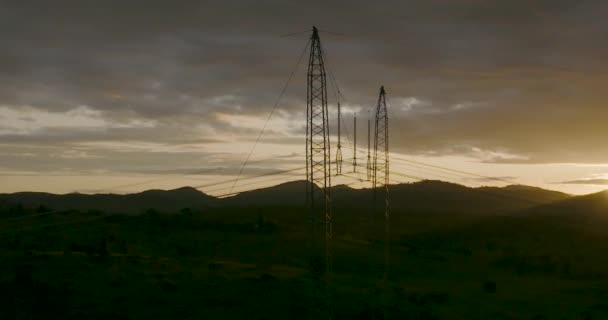 Dramatic Sunset Overhead Power Line Silhouette Foreground Aerial Circling — Stock videók