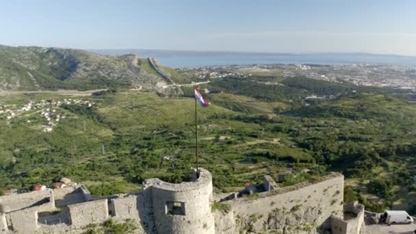 Flag Blows Tower Old Fortress Klis Croatia Aerial Drone Shot — Stockvideo