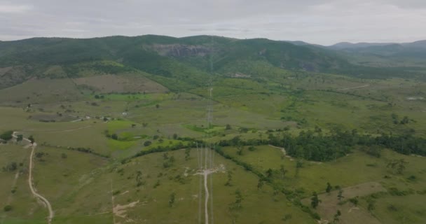 Aerial Flying Cables High Voltage Towers Tilt Shot Cables Road — Wideo stockowe