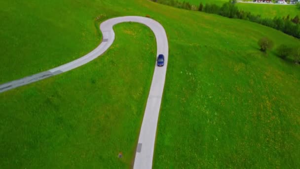 Volkswagen Golf Driving Alpine Road Surrounded Green Fields Austria — ストック動画