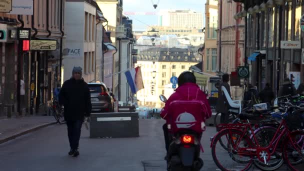 Person Rides Food Delivery Scooter Foodora Street Stockholm — Stockvideo