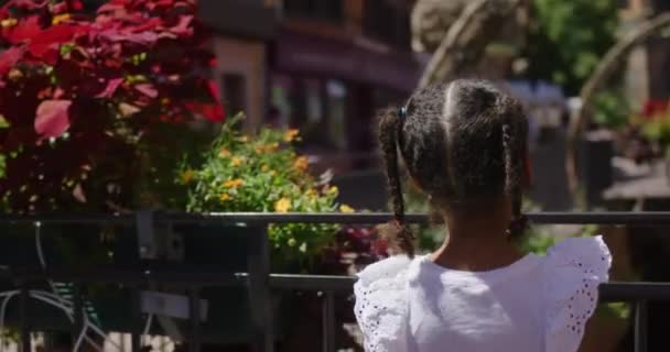 Biracial Little Girl Playing Turning See Gigantic Distant Catherdal Downtown — Stock Video