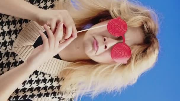 Young Woman Sad Lips Expression Twirly Red Paper Glasses Her — Vídeo de Stock