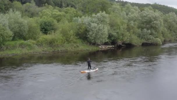 Aerial Orbits Lone Male Paddling Stand Paddleboard Small River — Stock Video