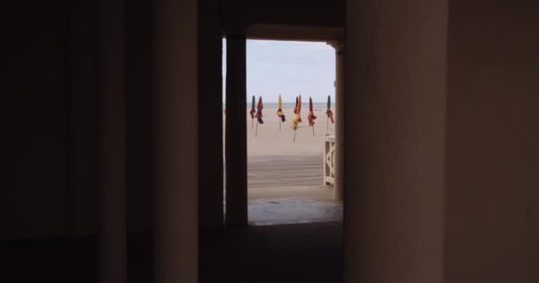 Folded Colorful Beach Umbrellas Viewed Doorway Building Deauville Calvados France — Stockvideo