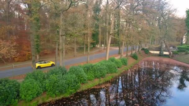 Yellow Tesla Car Driving Road Entrance Staverden Castle Netherlands Follow — Wideo stockowe