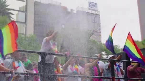 Lgbt Flags Being Waved Moving Bus Person Spraying Foam Crowds — Stockvideo