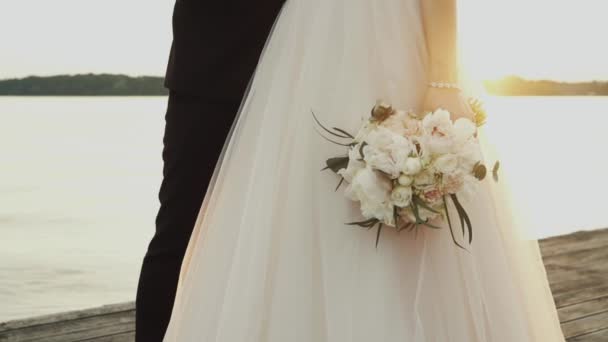 Bride Holding Bouquet Lake Sunset — Stockvideo