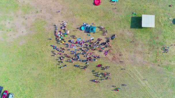 Descending Top Shot Crowd People Getting Baptized Field — Stock videók