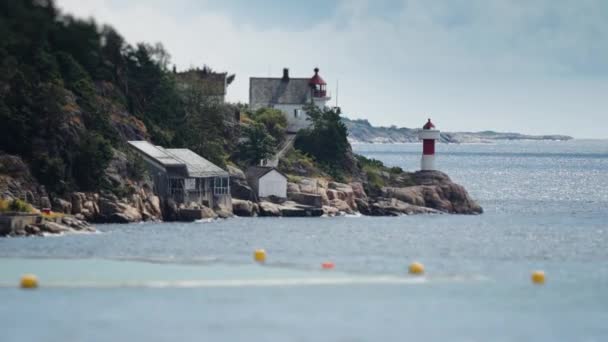 Lighthouses Rocky Shore Pan Follow — Stockvideo