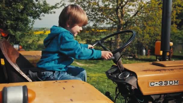 Boy Old Yellow Tractor Pretending Driving Turns Steering Wheel Trying — ストック動画