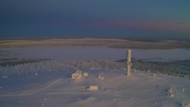 Aerial View Orbits Snow Covered Lapland Remote Cabin Communications Tower — 비디오
