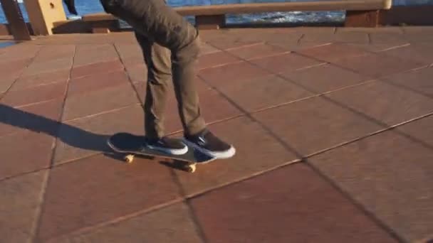 Millennial Kicking His Skateboard Close — Vídeos de Stock