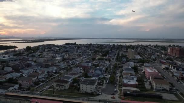 Aerial View Arverne Cloudy Beautiful Sunset Camera Truck Right Pan — Video