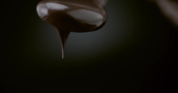 Dark Melted Chocolate Being Poured Spoon Pastry Close Shot — Stock Video