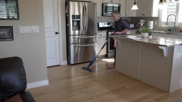 Senior Woman Spray Mopping Cleaning Her Hardwood Oak Floors Tilt — Vídeo de Stock