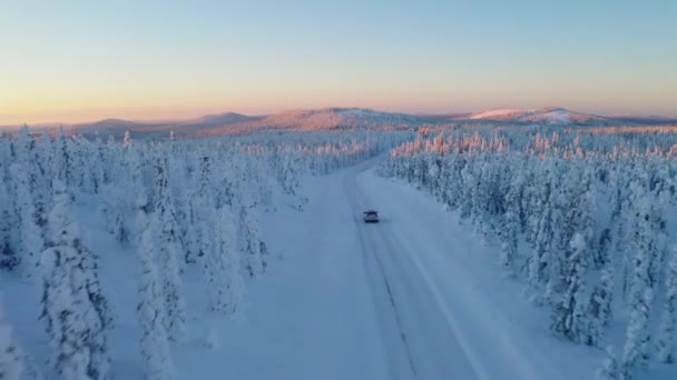 Aerial View Snowy Scandinavia Landscape Vehicle Driving Long Remote Road — 图库视频影像