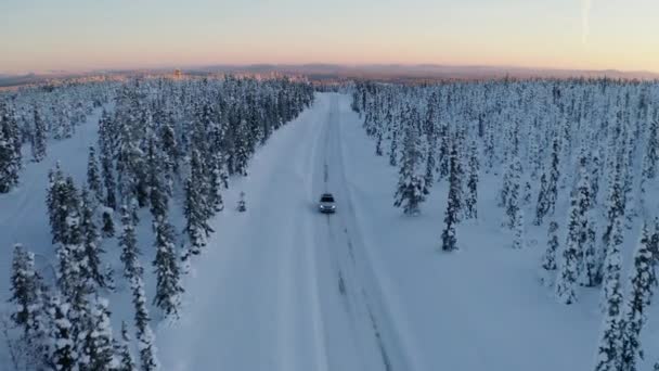 Aerial View Snowy Scandinavia Landscape Tracking Vehicle Driving Long Remote — Stockvideo