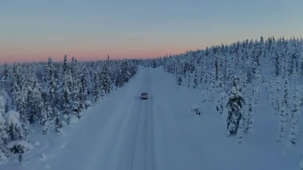 Aerial View Vehicle Journey Quiet Snowy Sweden Woodland Landscape Sunset — Stock videók