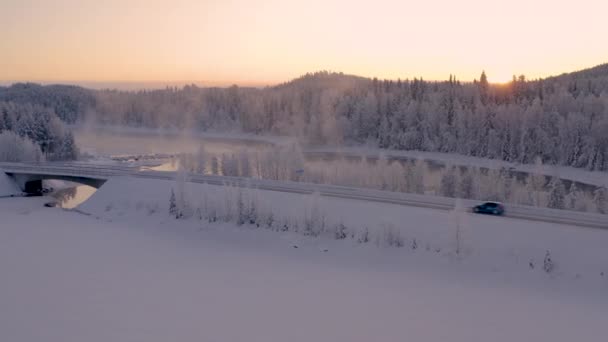 Aerial View Vehicle Crossing Quiet Snowy Sweden Mountain Landscape Sunrise — Vídeo de stock