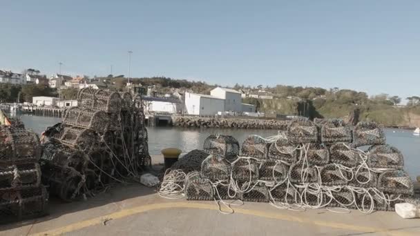 Lobster Pots Stacked Pier Await Fishermen Sunny Seaside Day — стоковое видео