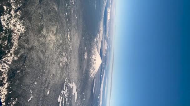 Snow Covered Rocky Mountain Range Birds Eye View Vertical Video — Stockvideo