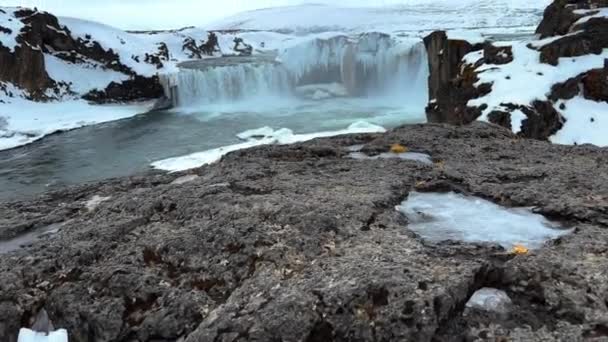 Slow Motion Tilt Shot Goafoss Waterfall Surrounded Snowy Hills Iceland — стоковое видео