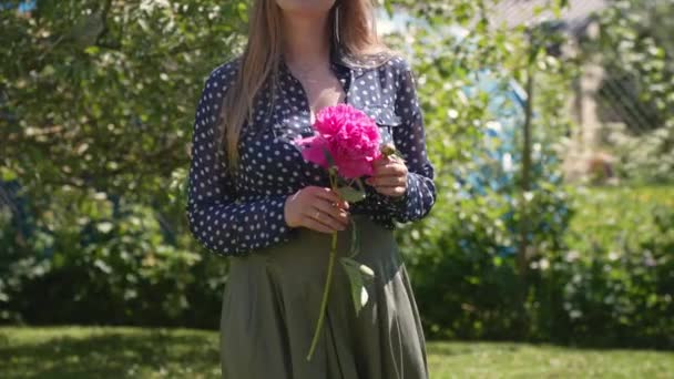 Attractive Young Woman Holding Peony Flower Walking Camera — Wideo stockowe