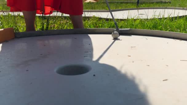 Woman Summer Dress Putting Ball Hole Mini Golf Field Close — Video