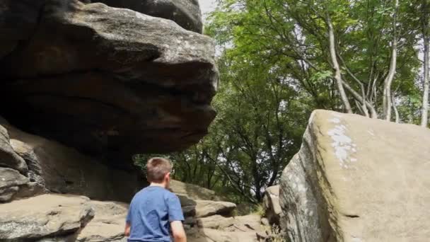 Young Boy Climbing Jumping Rocks Brimham Rocks Once Known Brimham — Stockvideo